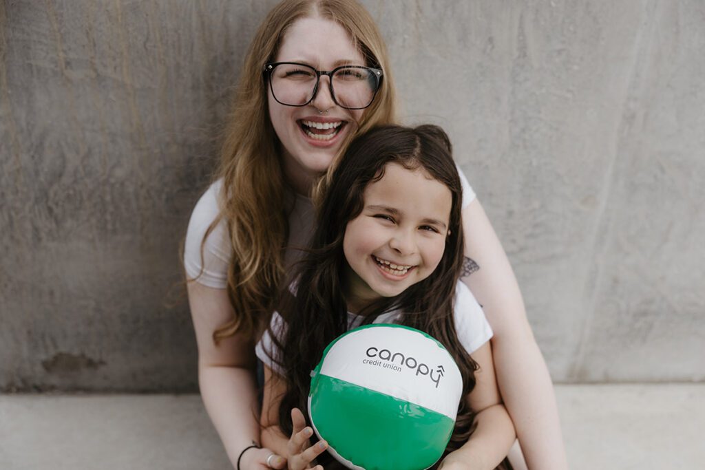 A happy mother and daughter laughing.